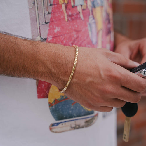 Gold Franco link bracelets featuring a classic, intricate chain design for a sleek and elegant look