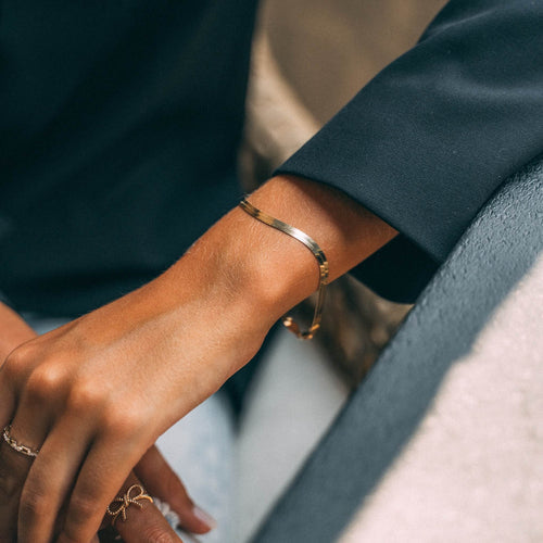 Gold herringbone bracelet with a 3.7mm width, featuring a sleek, flat design perfect for elegant and modern styling